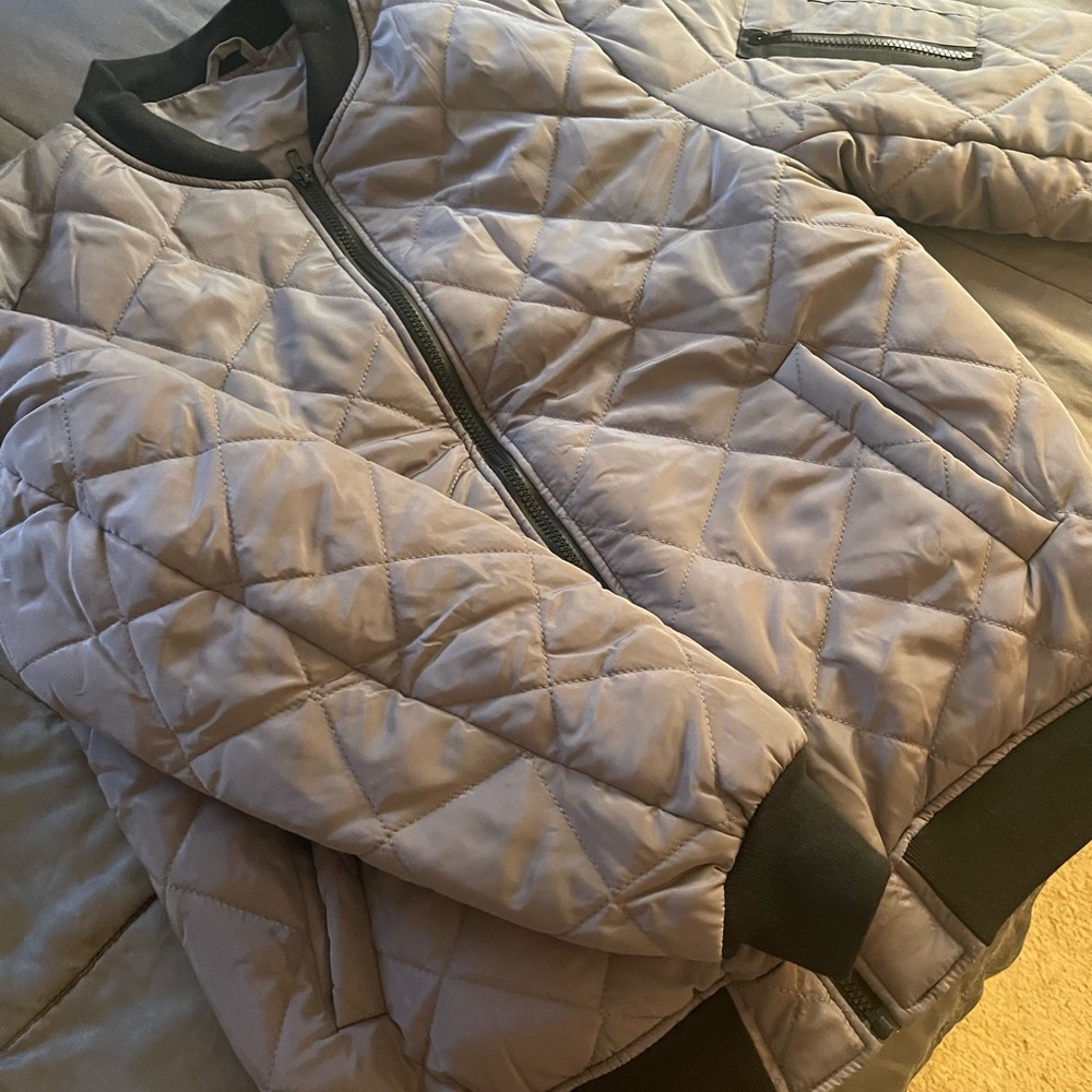 Grey quilted Bomber jacket. Never worn. New. No tags.